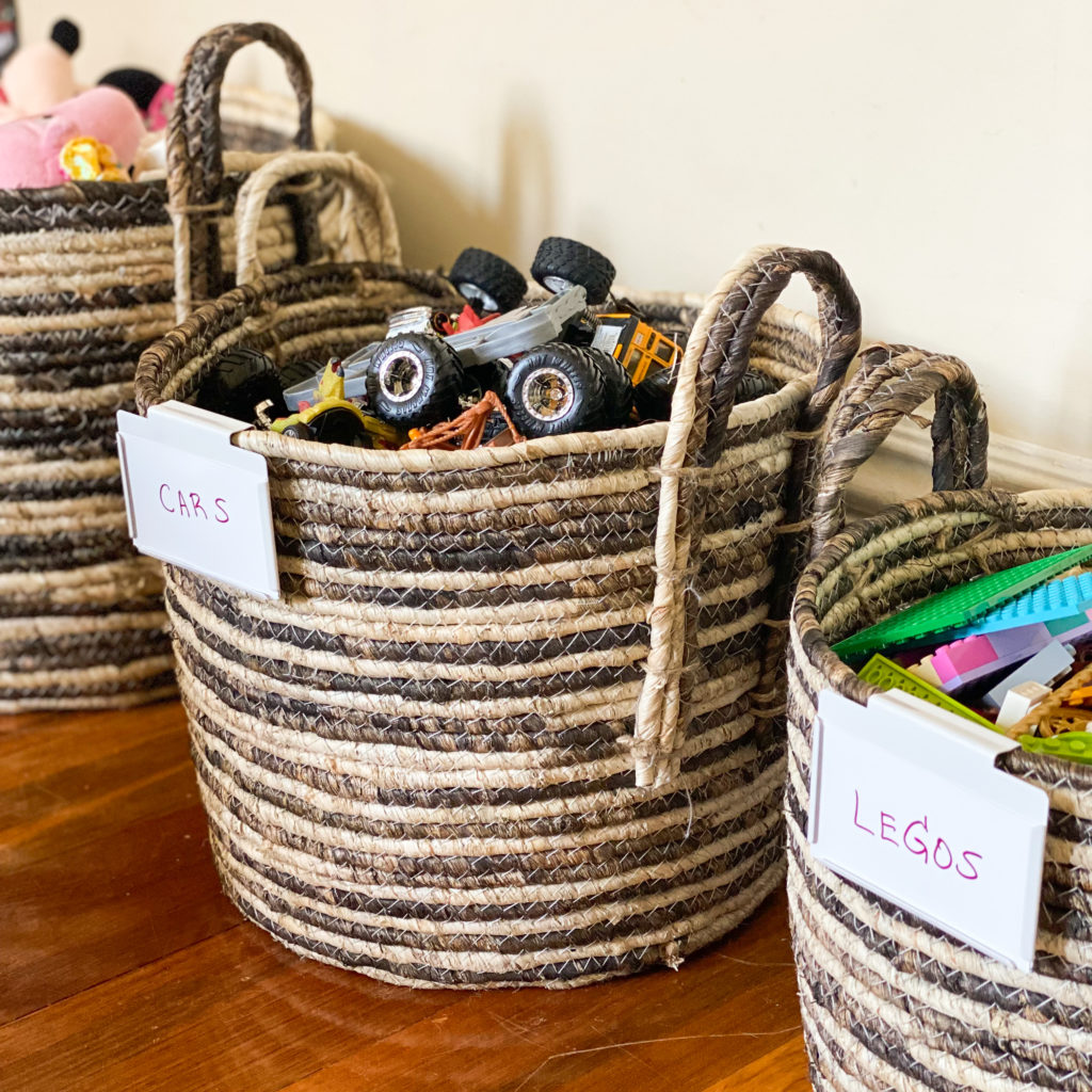 Various toys in round circular open baskets