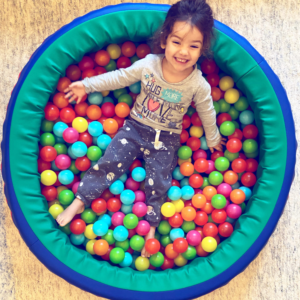 Toddler in ball pit